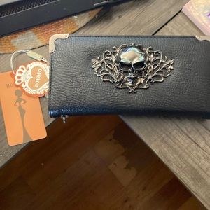 Black leather wallet with metal skull detail